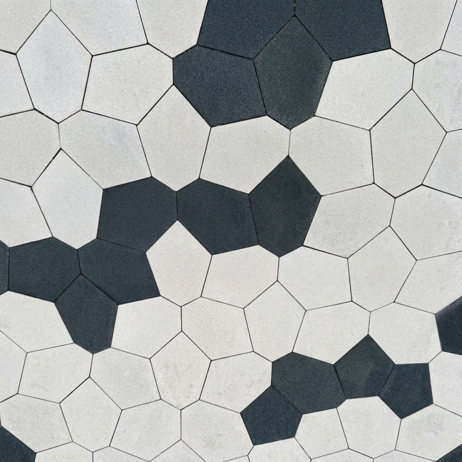 PENTA layout pattern in white with clustered black five-sided pavers